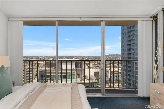 a view of balcony with a floor to ceiling window and wooden floor