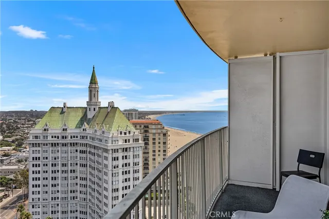 a view of a balcony with furniture