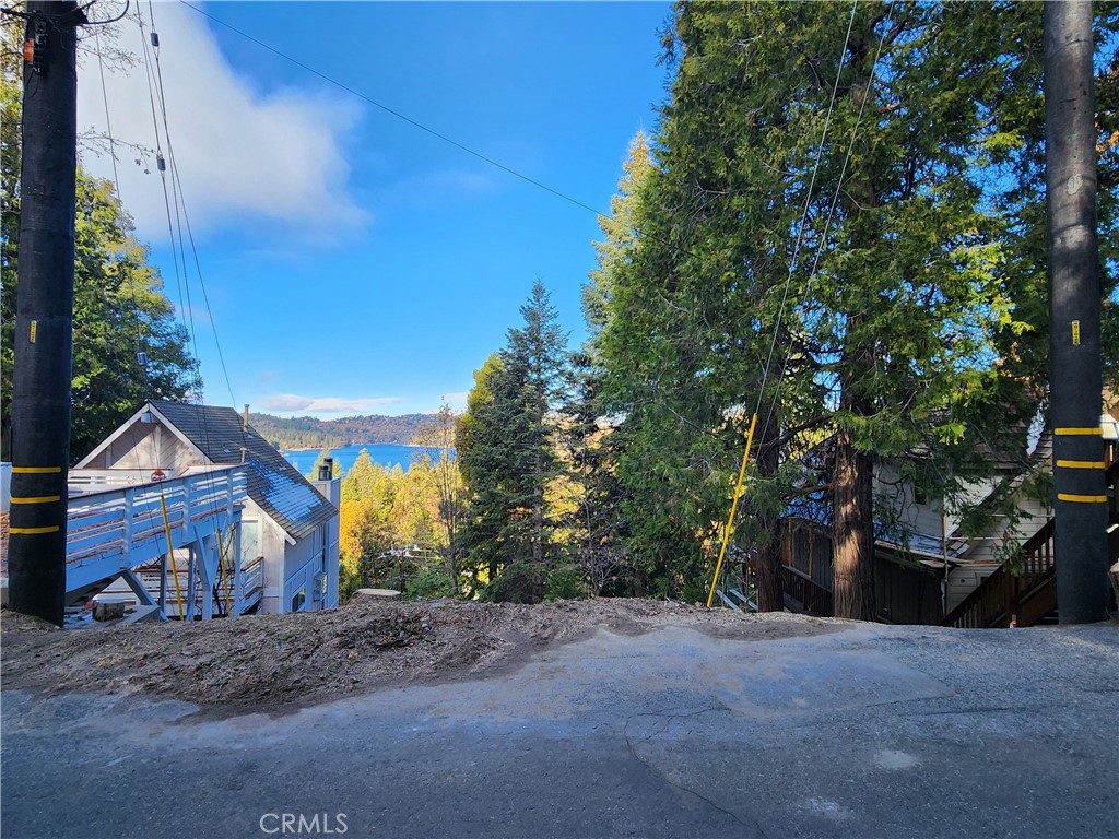 104 Fremont Road Lake Arrowhead, CA 92352 - Photo 14 of 15 a front view of a house with a yard and garage