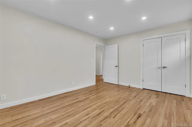 a view of an empty room and a window