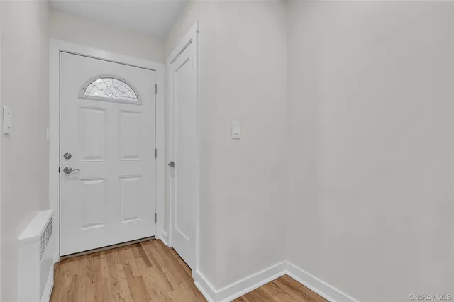 a view of balcony with wooden floor and fence