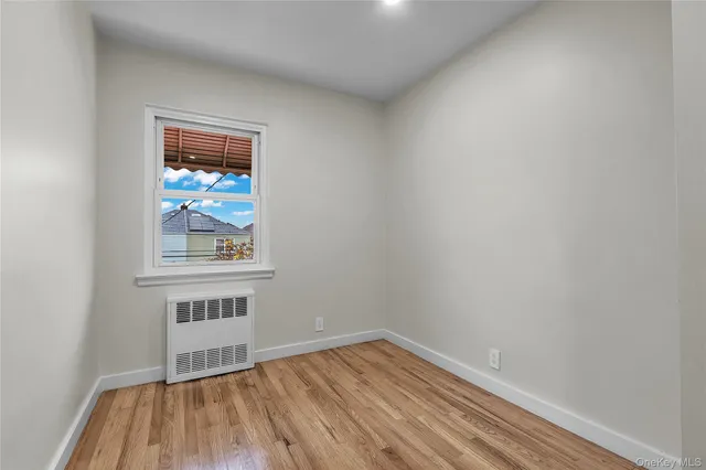 a bathroom with a granite countertop toilet and sink