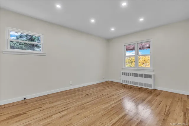 a view of room with wooden floor