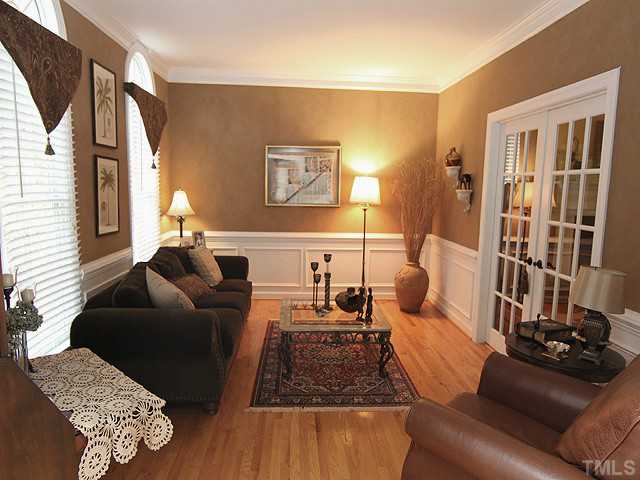 2809 Dray Court Raleigh, NC 27613 - Photo 3 of 13 Perfect space for formal living, music, office, or study. Hardwood floors, chair and crown molding, and french doors for extra privacy.