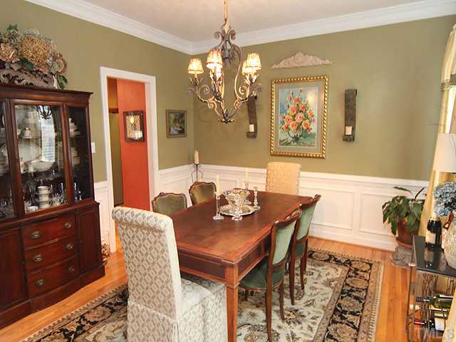 2809 Dray Court Raleigh, NC 27613 - Photo 4 of 13 Details are abundant in this lovely home. The dining room offers plenty of room for large gatherings with family and friends. Hardwood floors, chandelier, crown, and chair molding, and easy access to the kitchen.