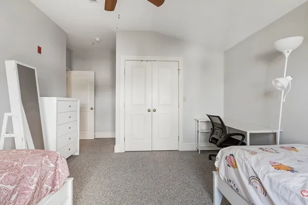 a bed room with a bed and a walk in closet