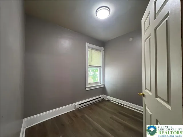 a view of an empty room and window