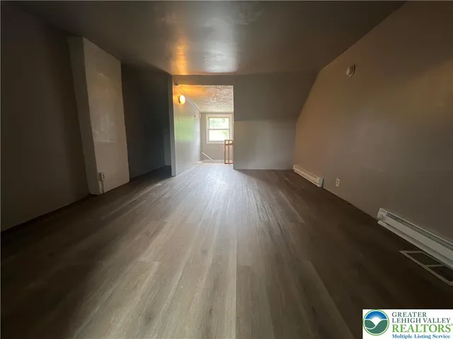 a view of an empty room and window