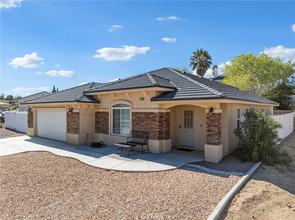 13064 Sage Hen Road Victorville, CA 92395 - Photo 1 of 1 a front view of a house with a yard