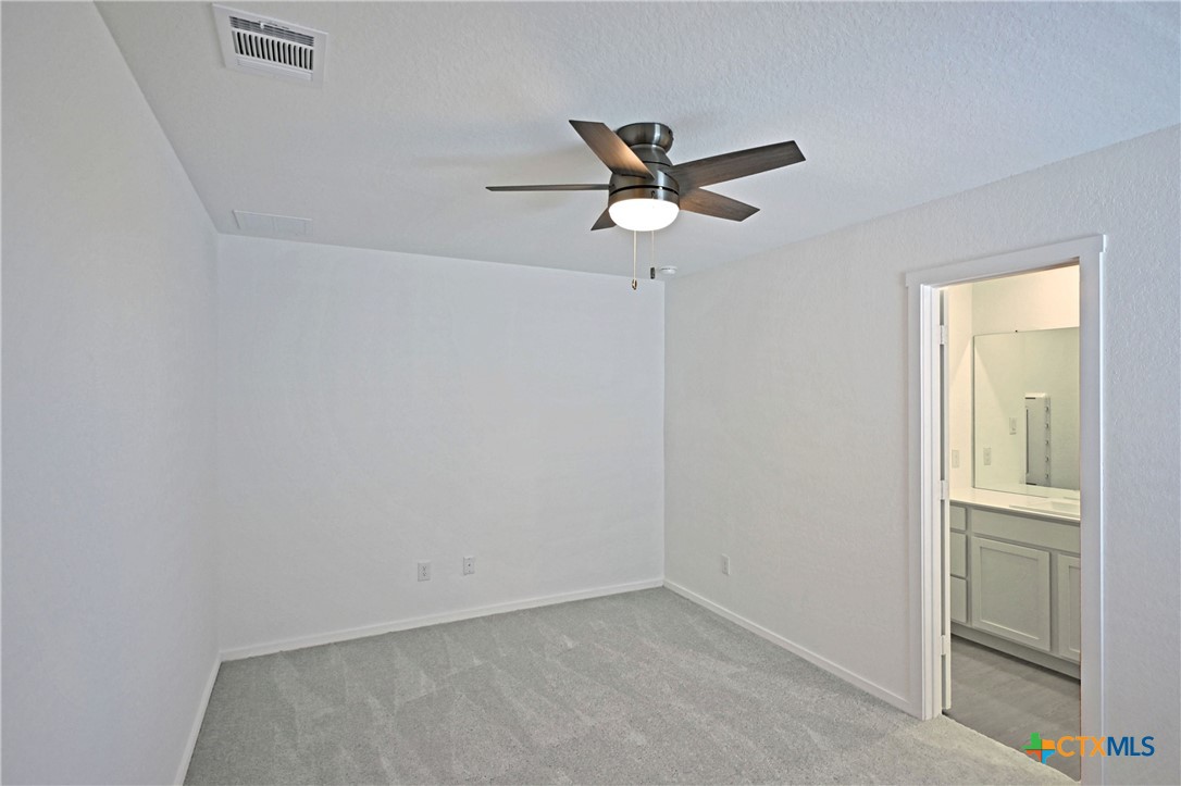 11822 Bluebell Ridge Converse, TX 78109 - Photo 12 of 24 a view of a big room with wooden floor and cabinet