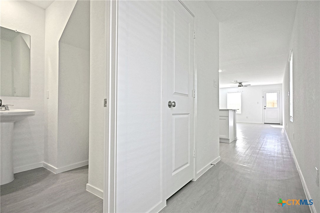 11822 Bluebell Ridge Converse, TX 78109 - Photo 2 of 24 a view of a hallway with wooden floor