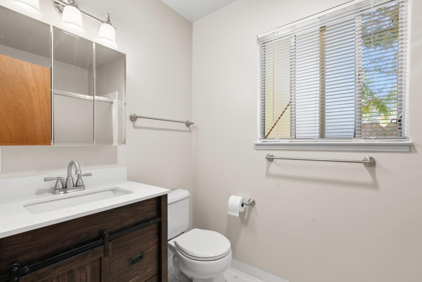 1450 Merrill Street Santa Cruz, CA 95062 - Photo 18 of 21 a bathroom with a sink a toilet and a window
