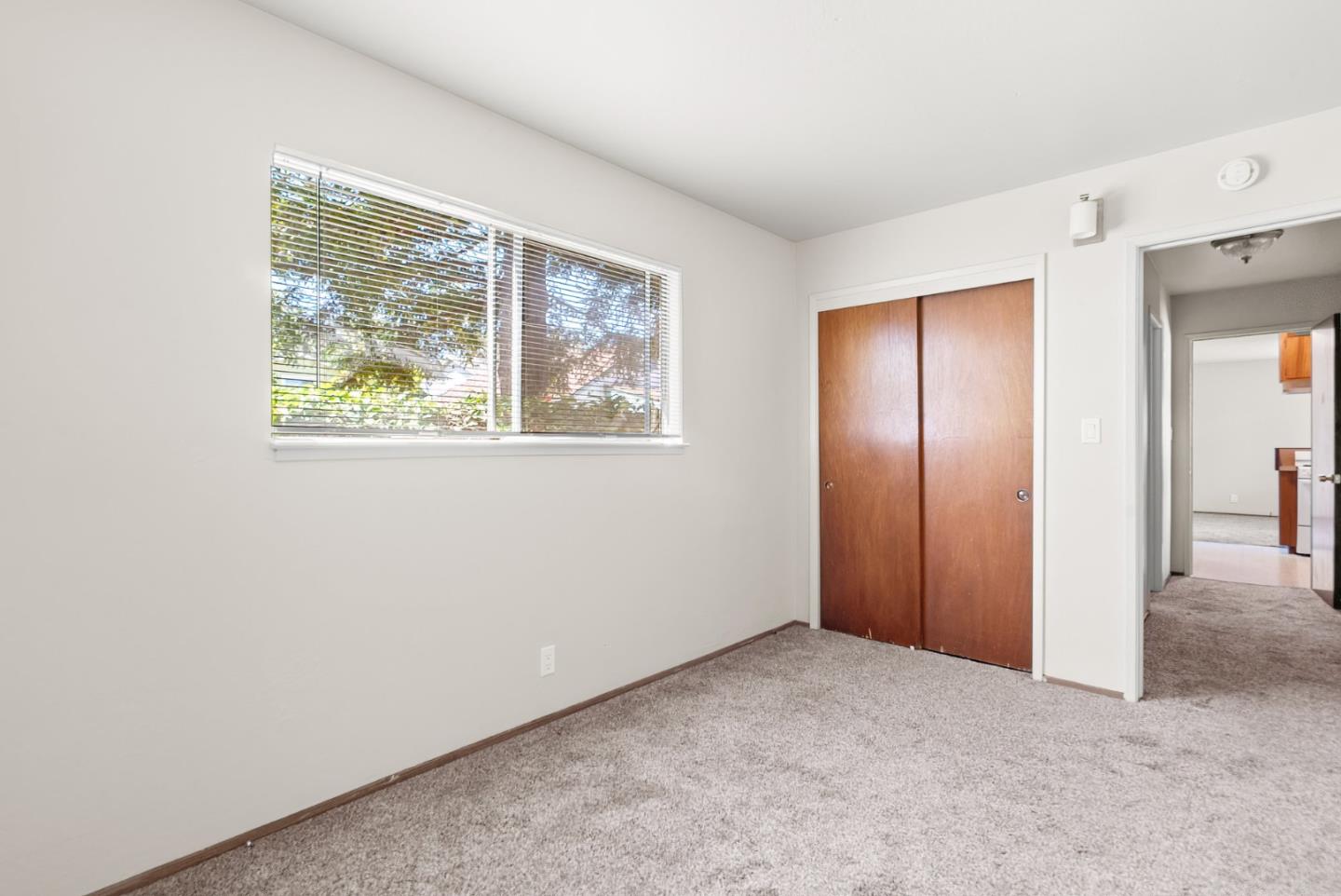 1450 Merrill Street Santa Cruz, CA 95062 - Photo 19 of 21 an empty room with windows and closet