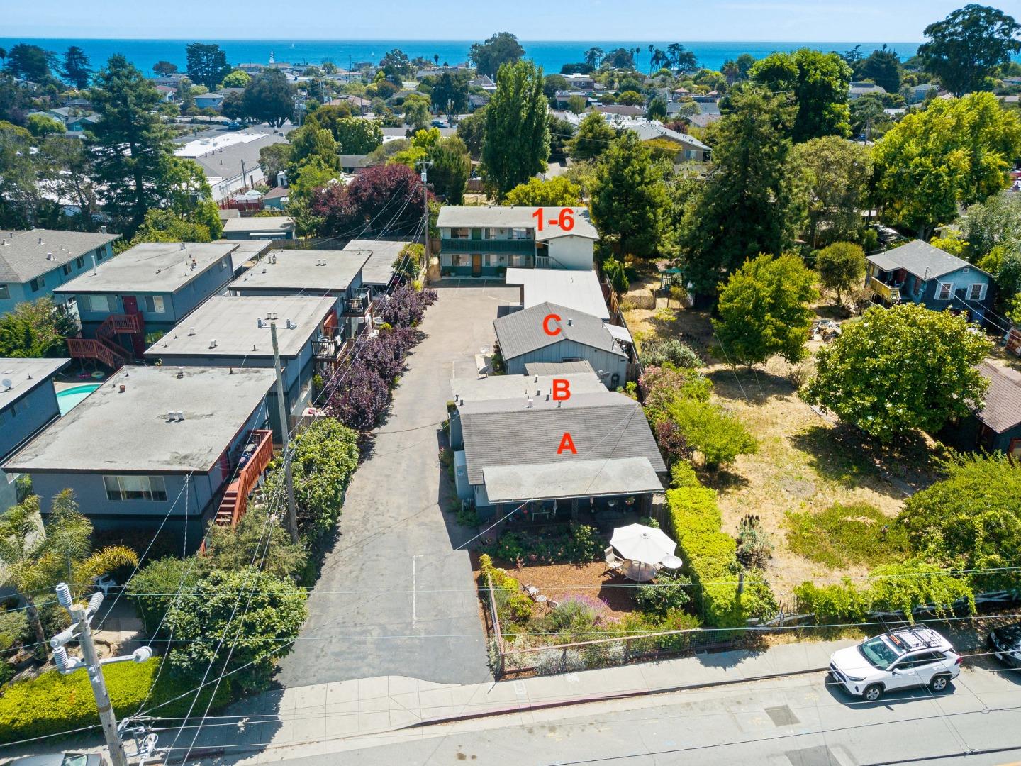 1450 Merrill Street Santa Cruz, CA 95062 - Photo 3 of 21 an aerial view of a house with a garden and mountain view in back