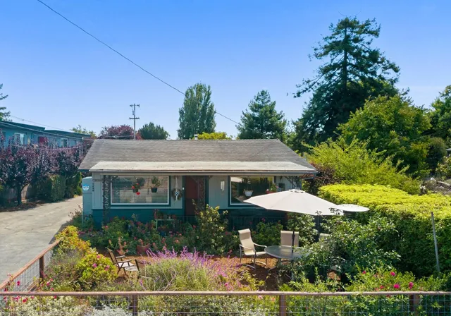 a view of a patio with furniture and a yard