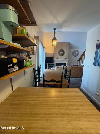 a view of kitchen and dining room with furniture