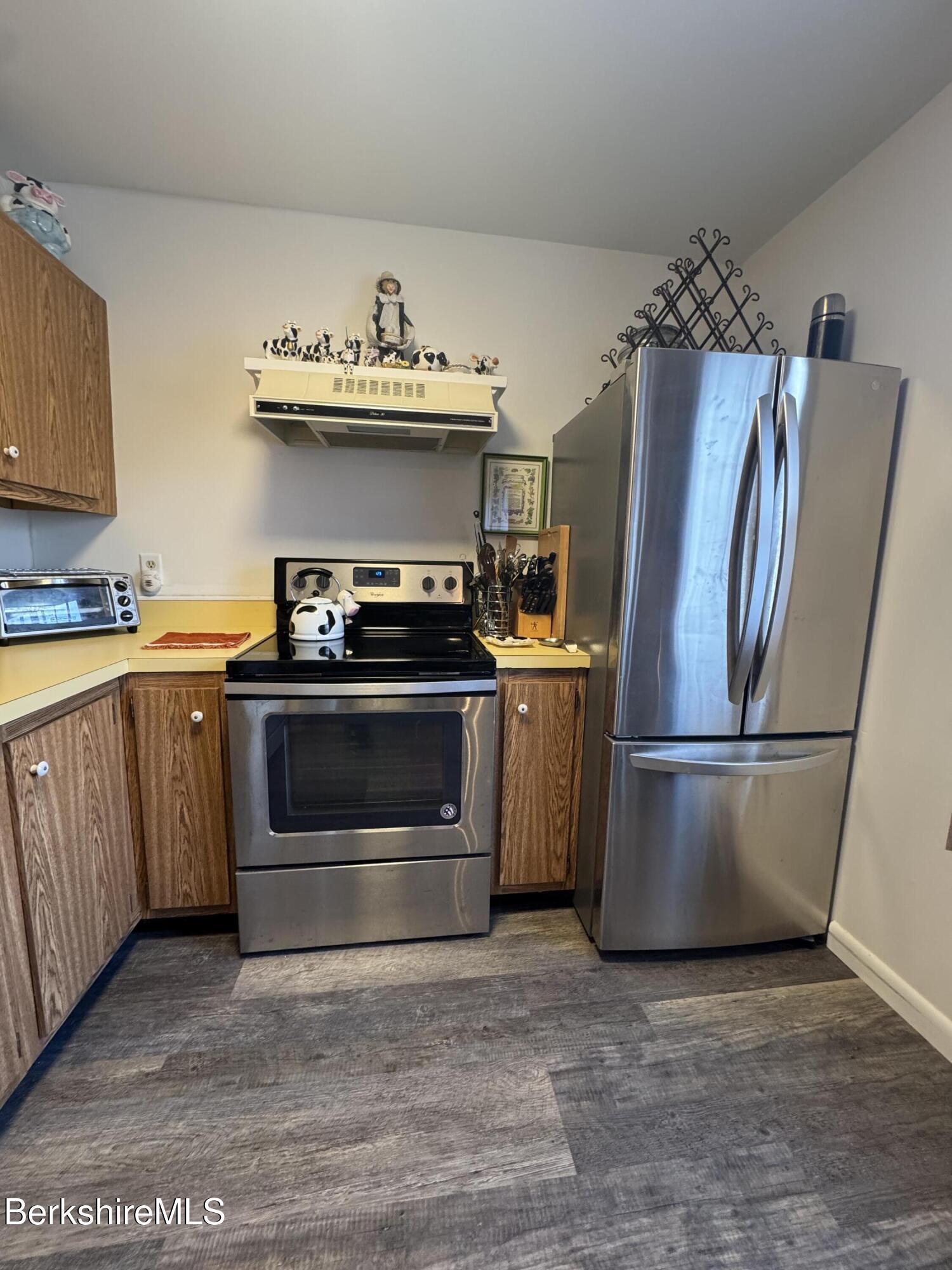 37 Corey Road, Unit 14 Hancock, MA 01237 - Photo 15 of 30 a kitchen with a stove top oven and refrigerator