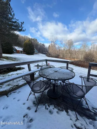 a view of a backyard with furniture