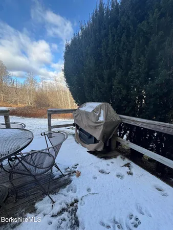 a view of a chairs and table in the patio