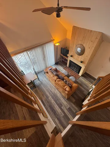 a view of living room with furniture and a rug
