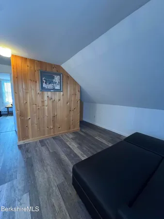 an empty room with wooden floor