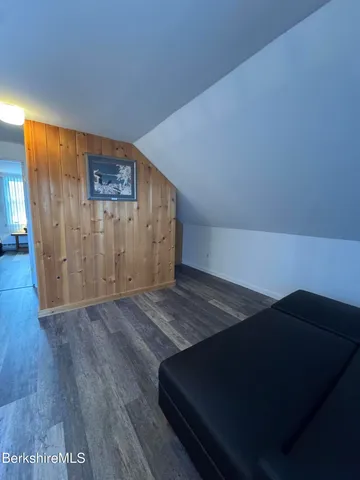 an empty room with wooden floor