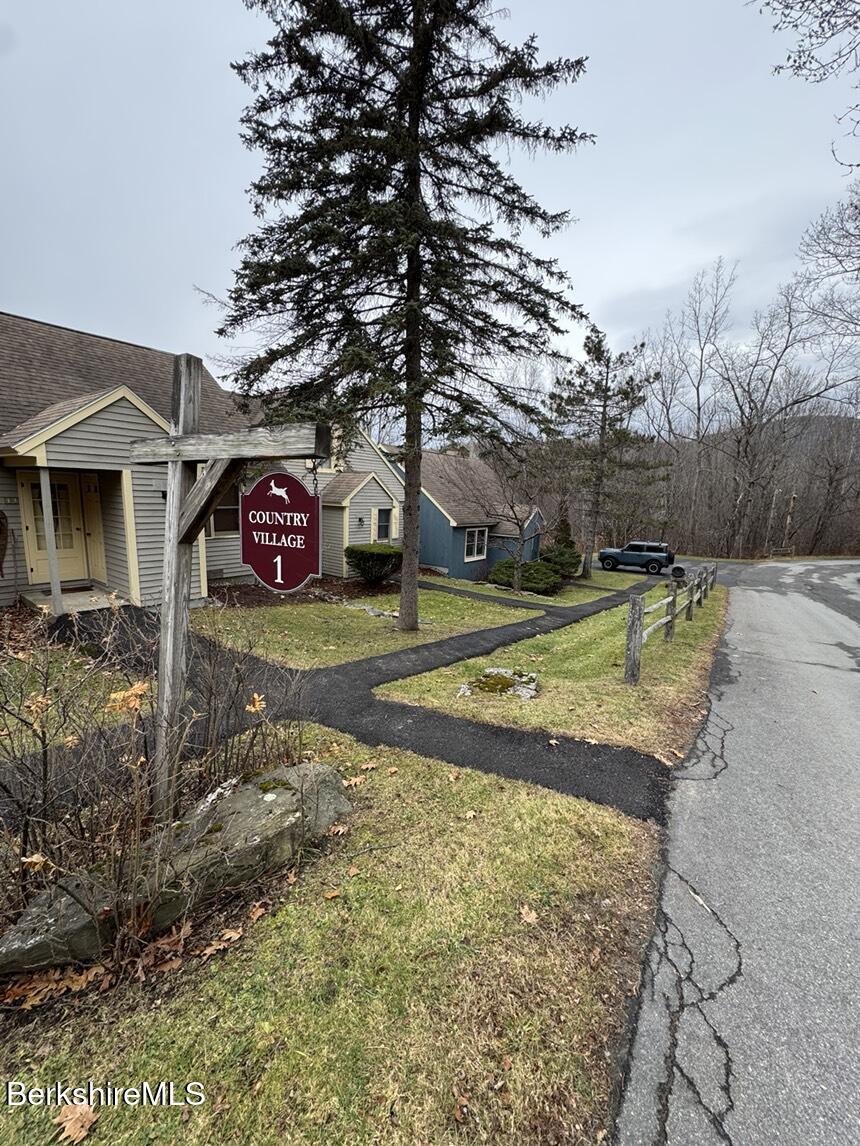 37 Corey Road, Unit 14 Hancock, MA 01237 - Photo 3 of 30 a view of a tennis ground with large trees