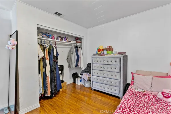 a view of a bedroom with baby crib