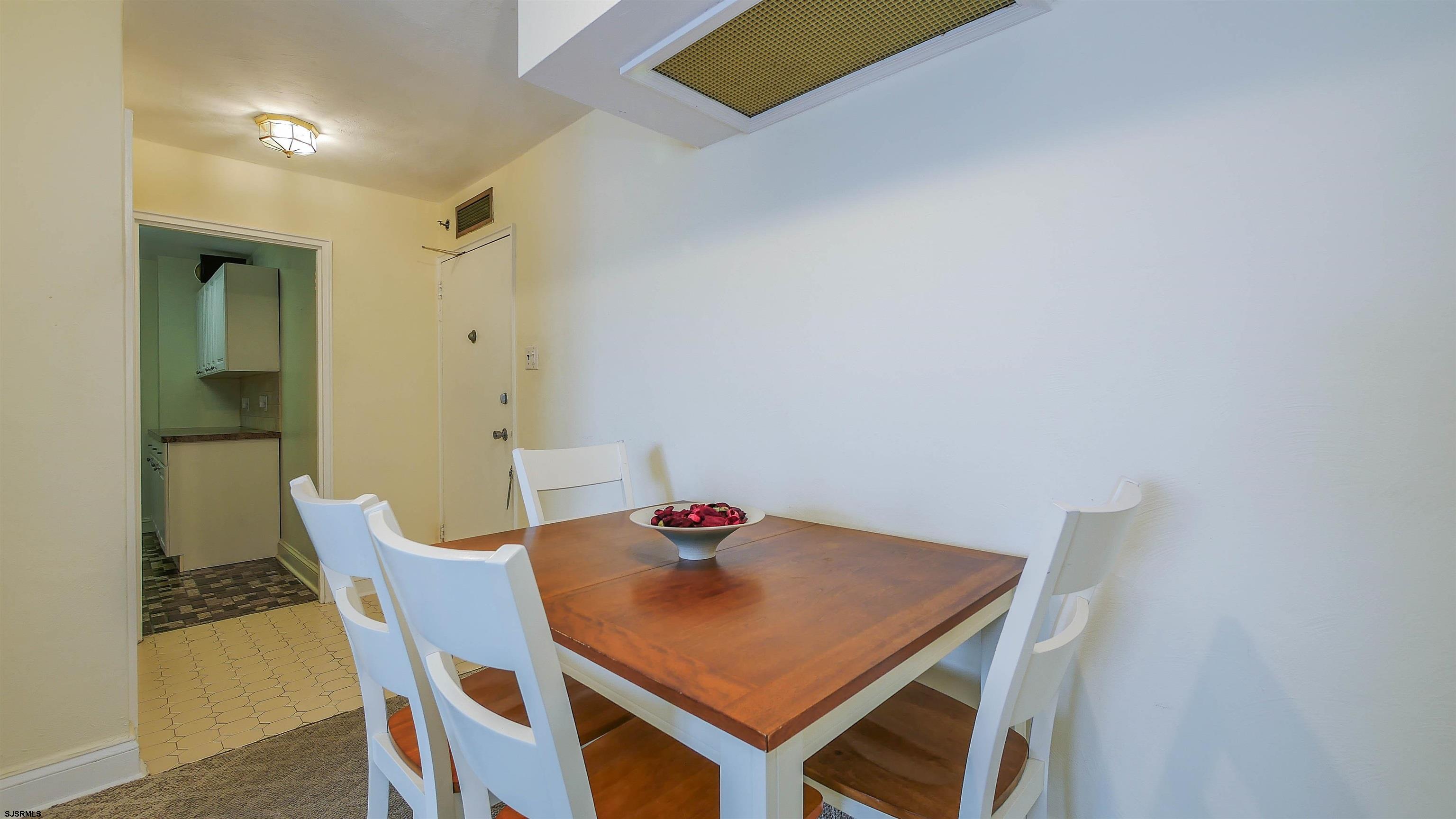 101 South Raleigh Avenue, Unit 207 Atlantic City, NJ 08401 - Photo 11 of 30 a view of a room that has a table and chairs in it