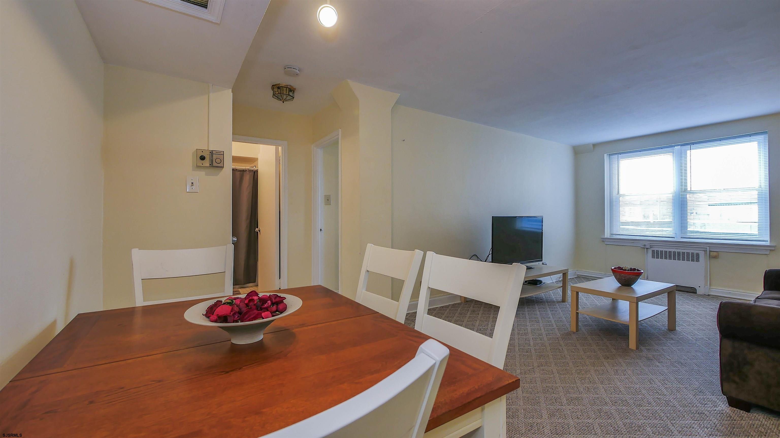 101 South Raleigh Avenue, Unit 207 Atlantic City, NJ 08401 - Photo 12 of 30 a living room with furniture and a table