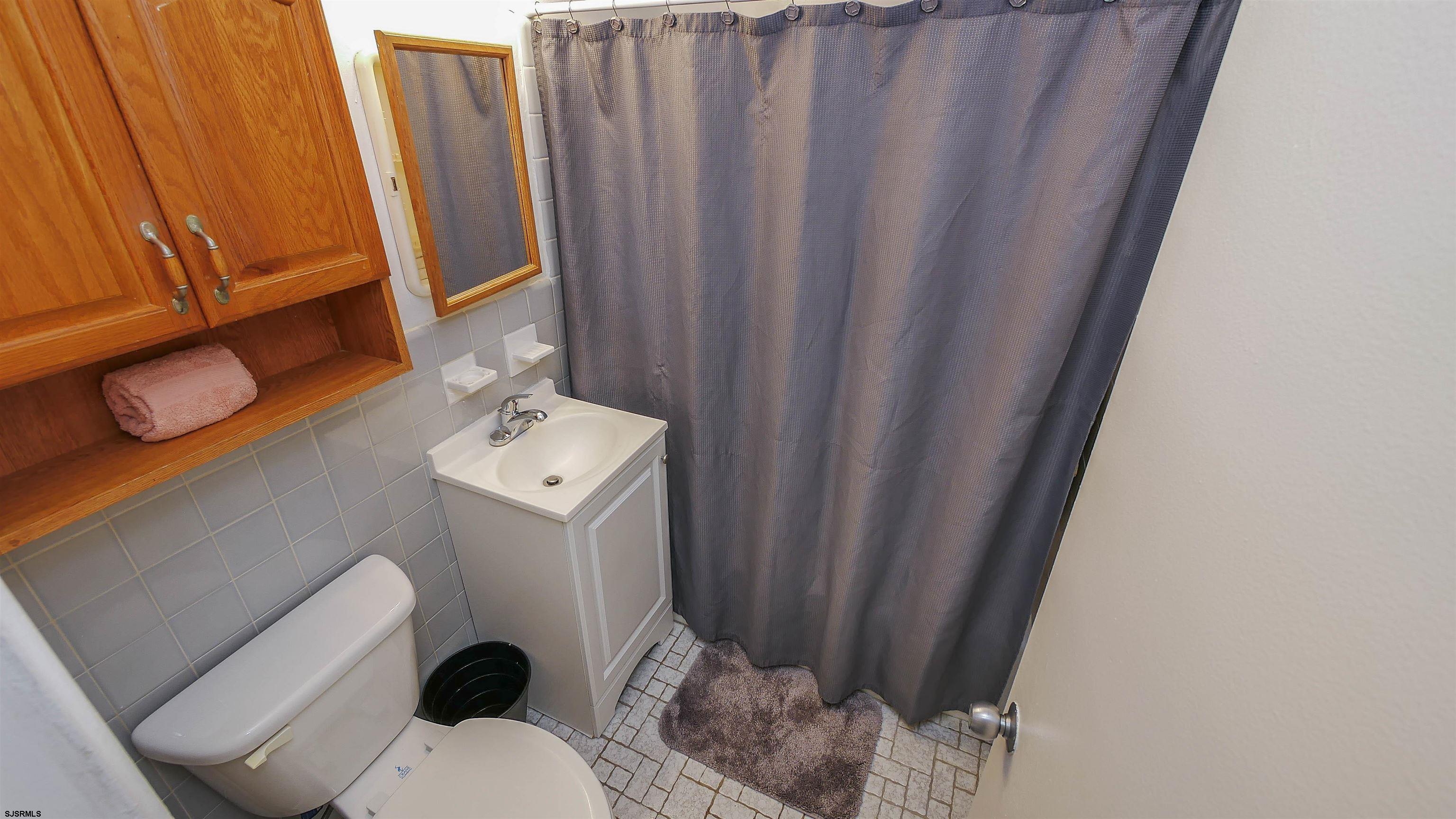 101 South Raleigh Avenue, Unit 207 Atlantic City, NJ 08401 - Photo 18 of 30 a bathroom with a sink and toilet