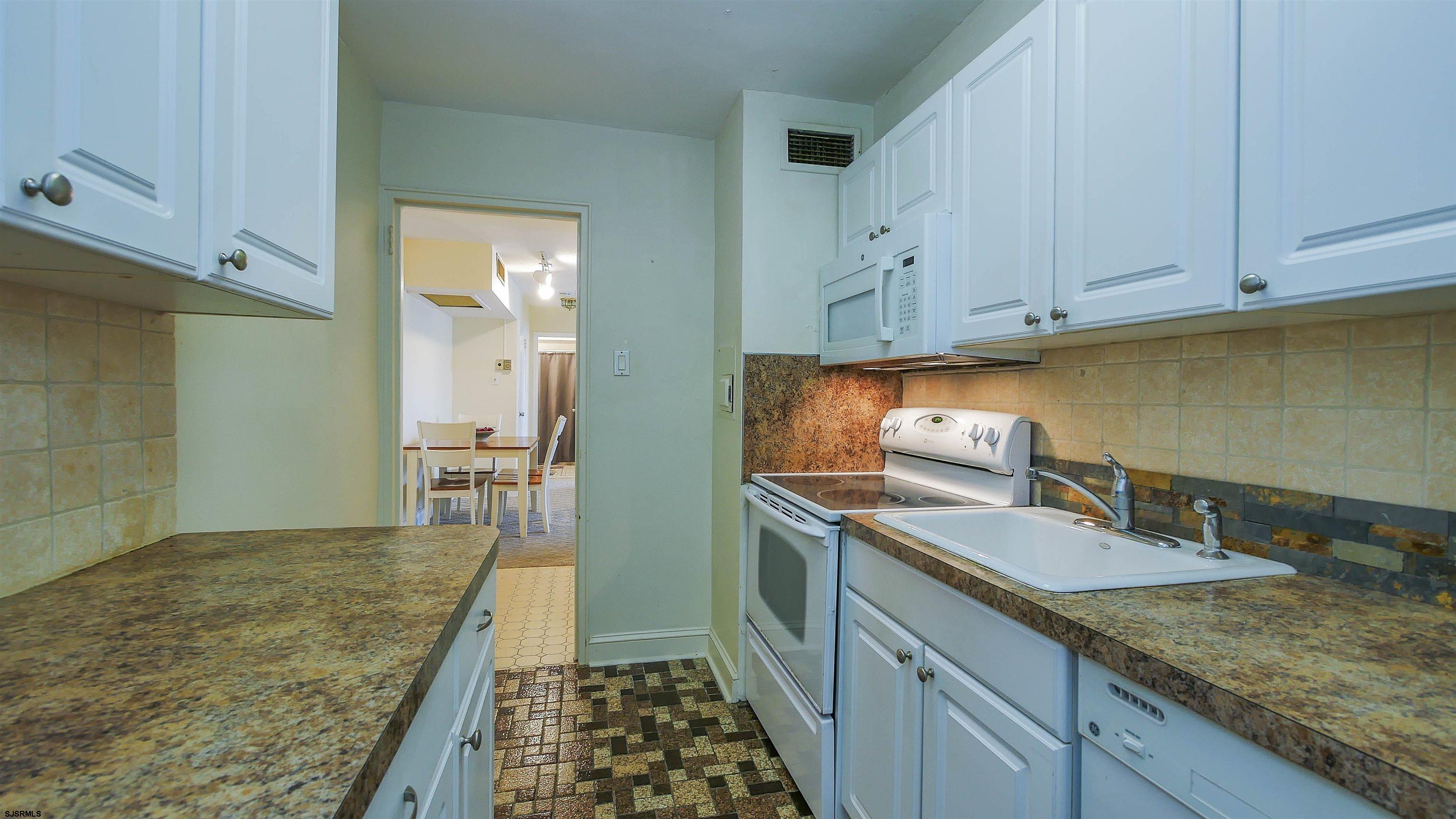 101 South Raleigh Avenue, Unit 207 Atlantic City, NJ 08401 - Photo 9 of 30 a kitchen with sink and cabinets