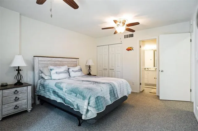 a bathroom with a granite countertop shower sink and mirror