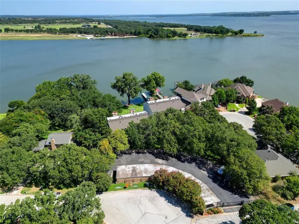 an aerial view of a house with a lake view