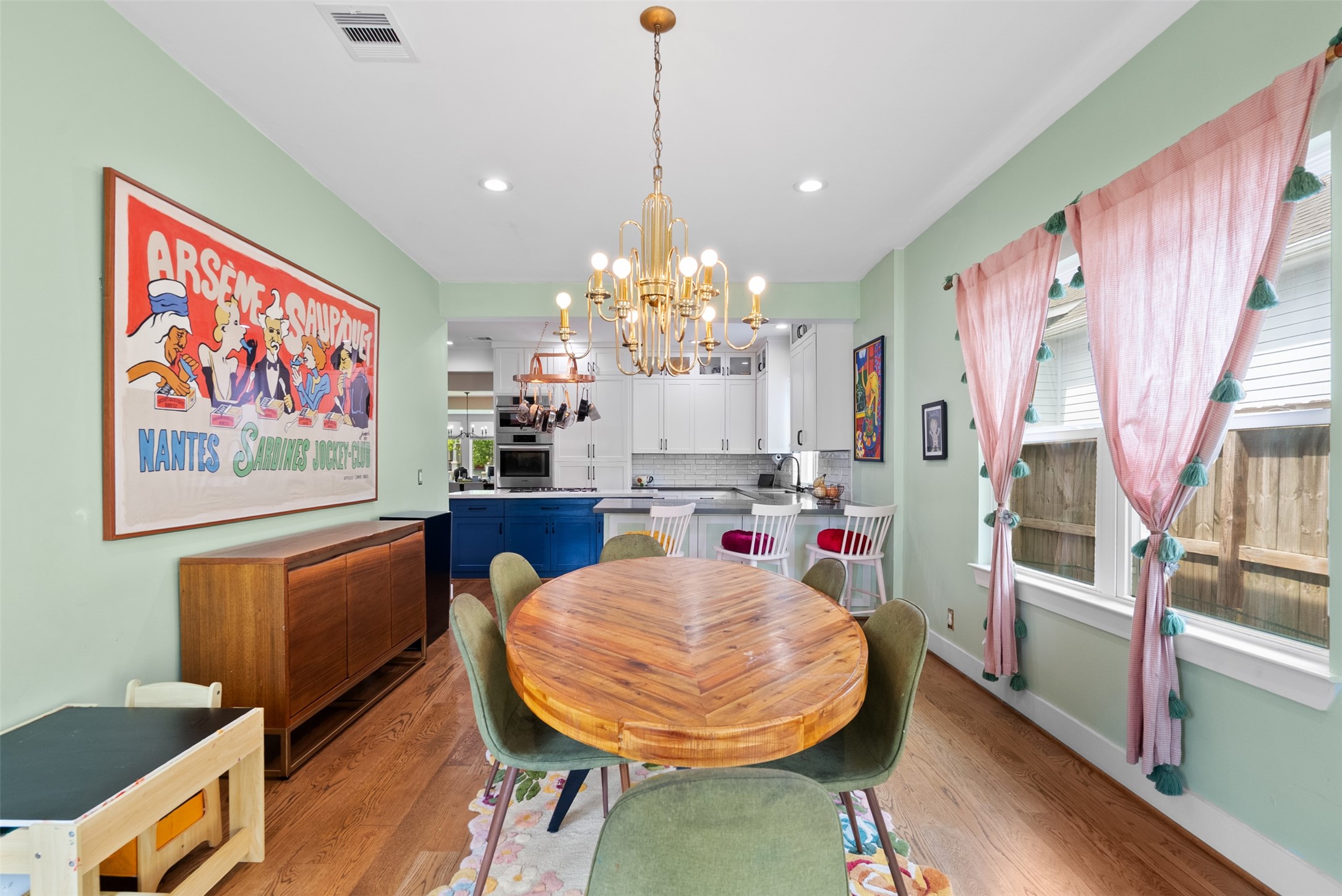4503 McKinney Street Houston, TX 77023 - Photo 15 of 37 a view of a dining room with furniture a rug and wooden floor