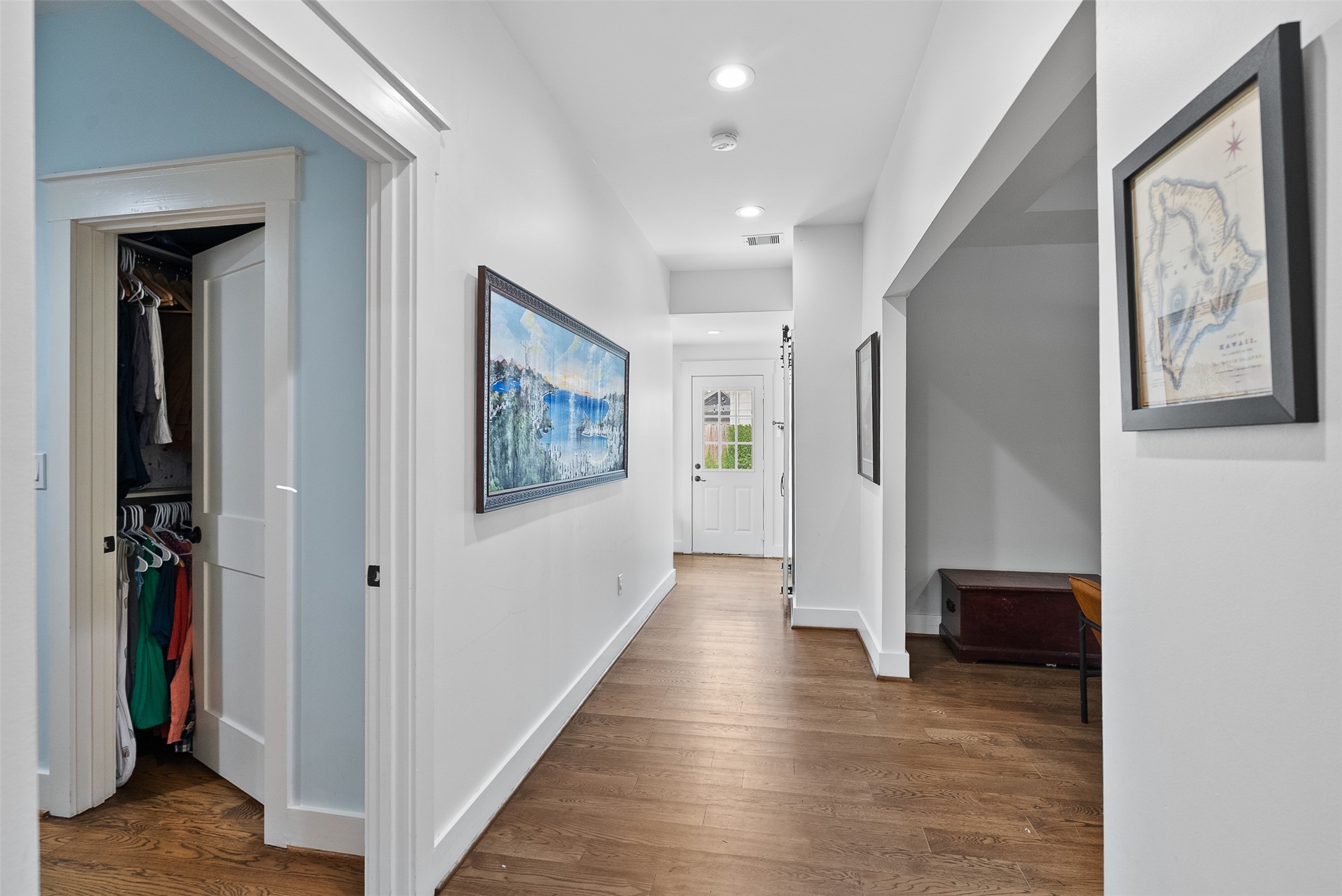 4503 McKinney Street Houston, TX 77023 - Photo 20 of 37 a view of hallway with stairs and wooden floor