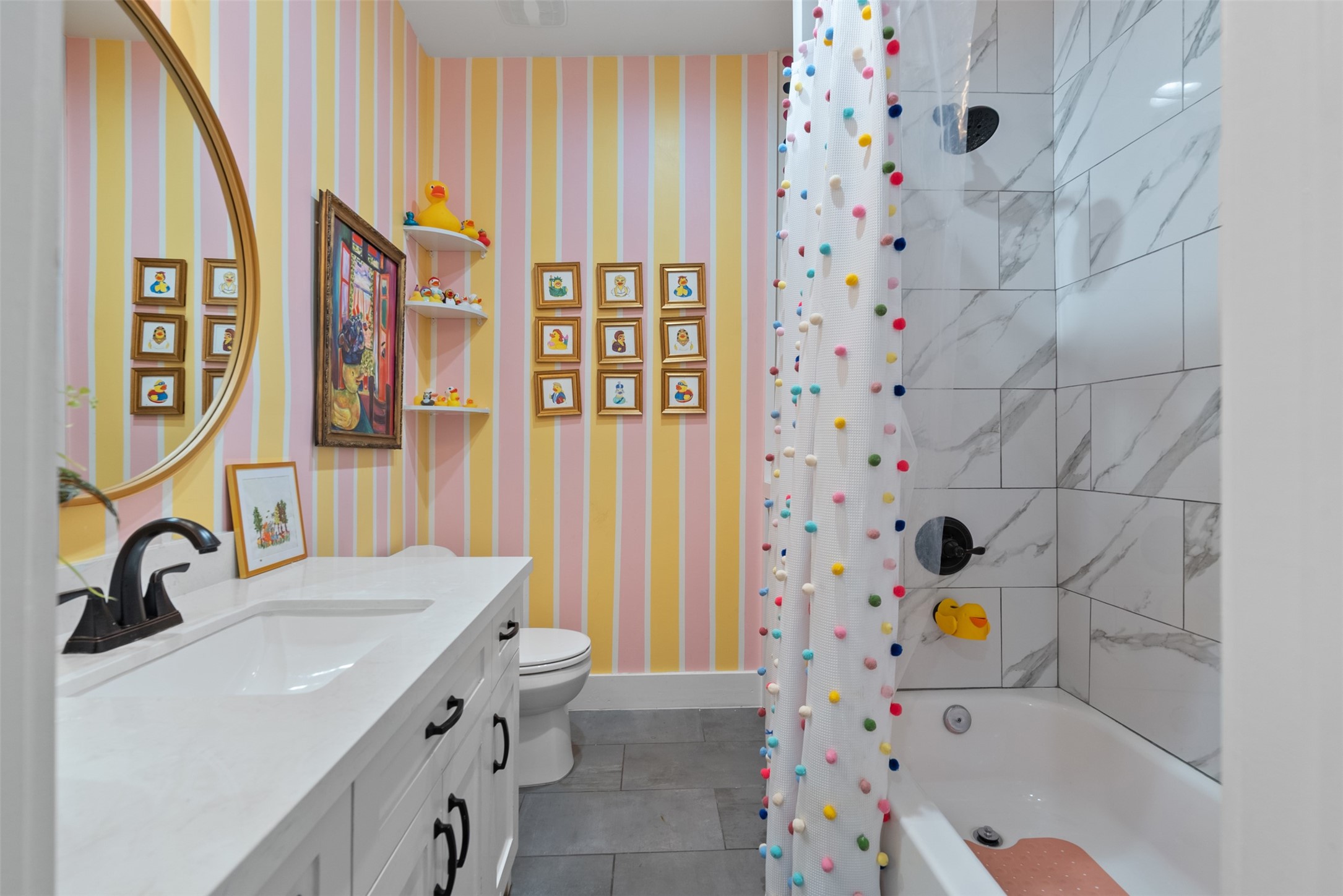 4503 McKinney Street Houston, TX 77023 - Photo 25 of 37 a bathroom with a sink a mirror and a bathtub