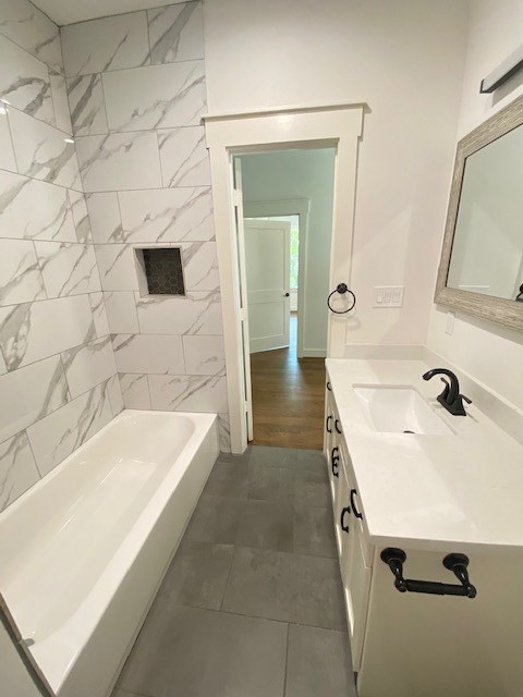 4503 McKinney Street Houston, TX 77023 - Photo 27 of 37 a bathroom with a tub sink and mirror