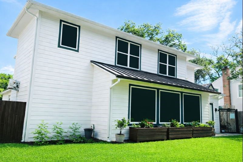 4503 McKinney Street Houston, TX 77023 - Photo 34 of 37 a front view of a house with a yard and garage