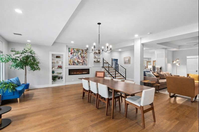 4503 McKinney Street Houston, TX 77023 - Photo 7 of 37 a dining room with furniture potted plants and wooden floor