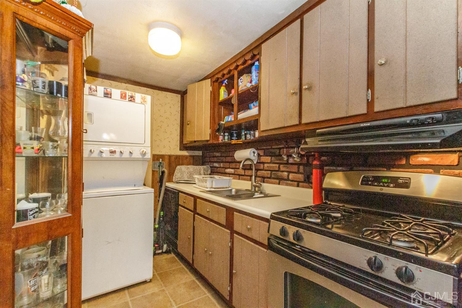 104 Oak Grove Road Flemington, NJ 08822 - Photo 14 of 25 a kitchen with stainless steel appliances granite countertop a stove and a refrigerator