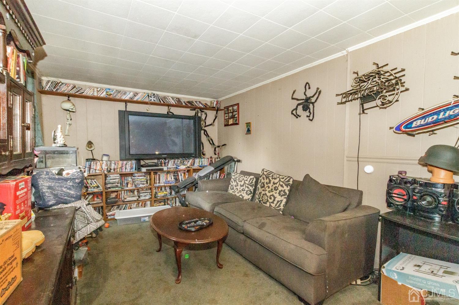 104 Oak Grove Road Flemington, NJ 08822 - Photo 16 of 25 a living room with furniture and a flat screen tv
