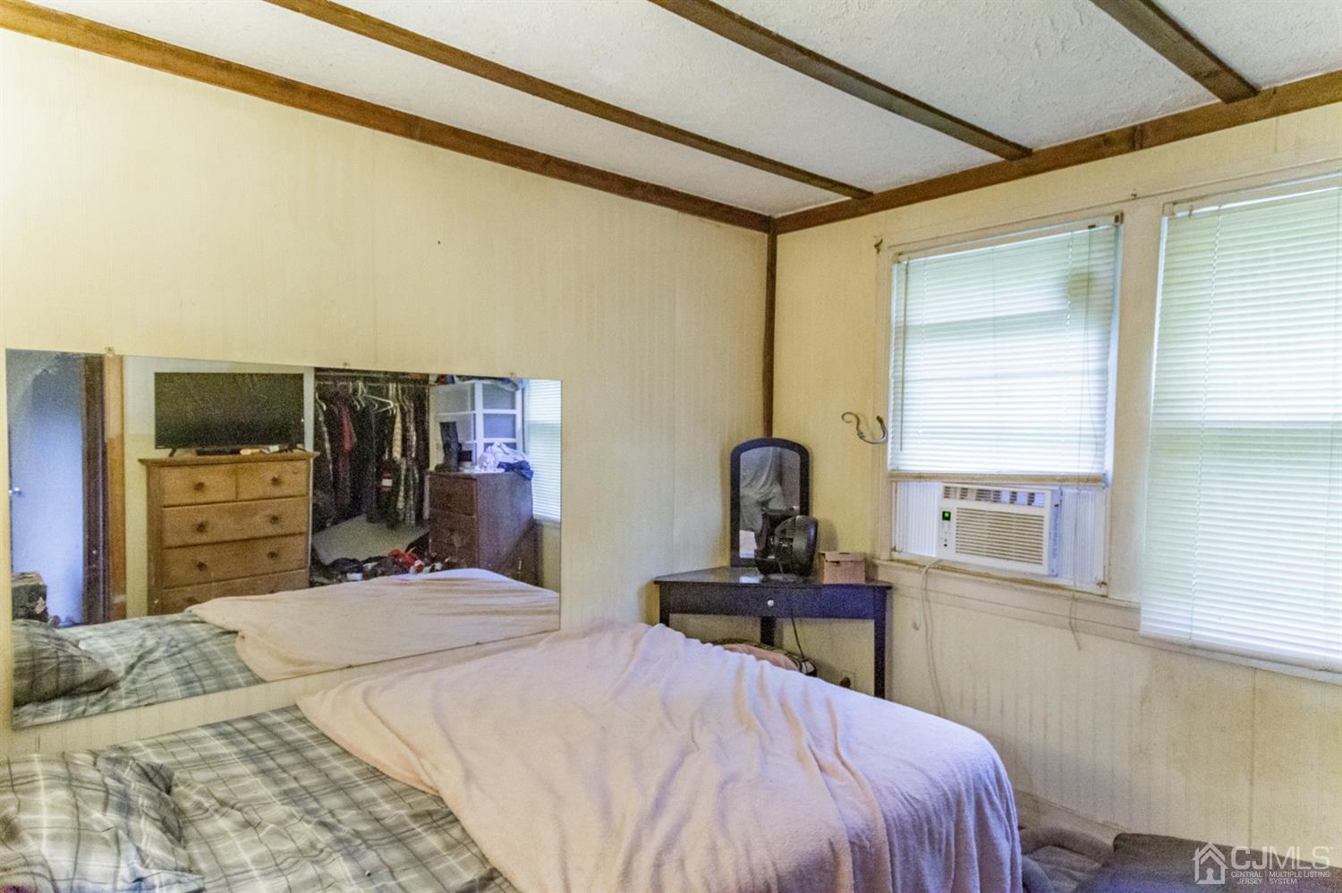 104 Oak Grove Road Flemington, NJ 08822 - Photo 17 of 25 a bedroom with a bed and a television