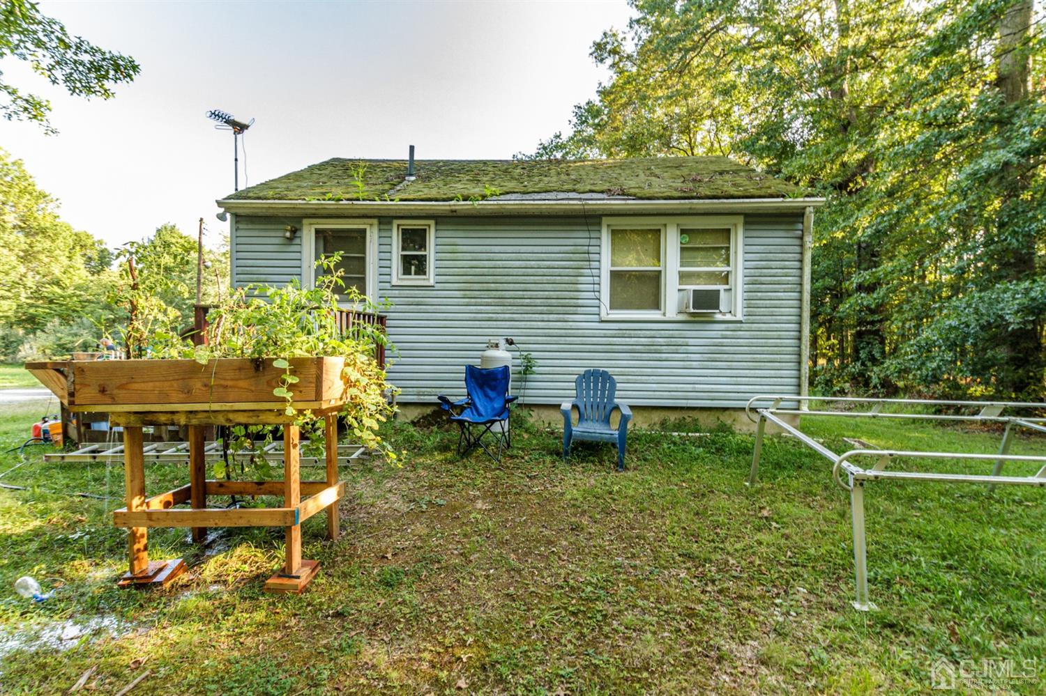 104 Oak Grove Road Flemington, NJ 08822 - Photo 19 of 25 a backyard of a house with table and chairs