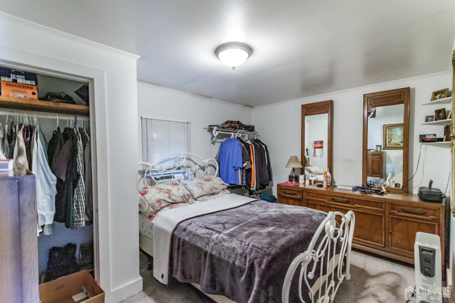 104 Oak Grove Road Flemington, NJ 08822 - Photo 7 of 25 a bedroom with a bed and a mirror