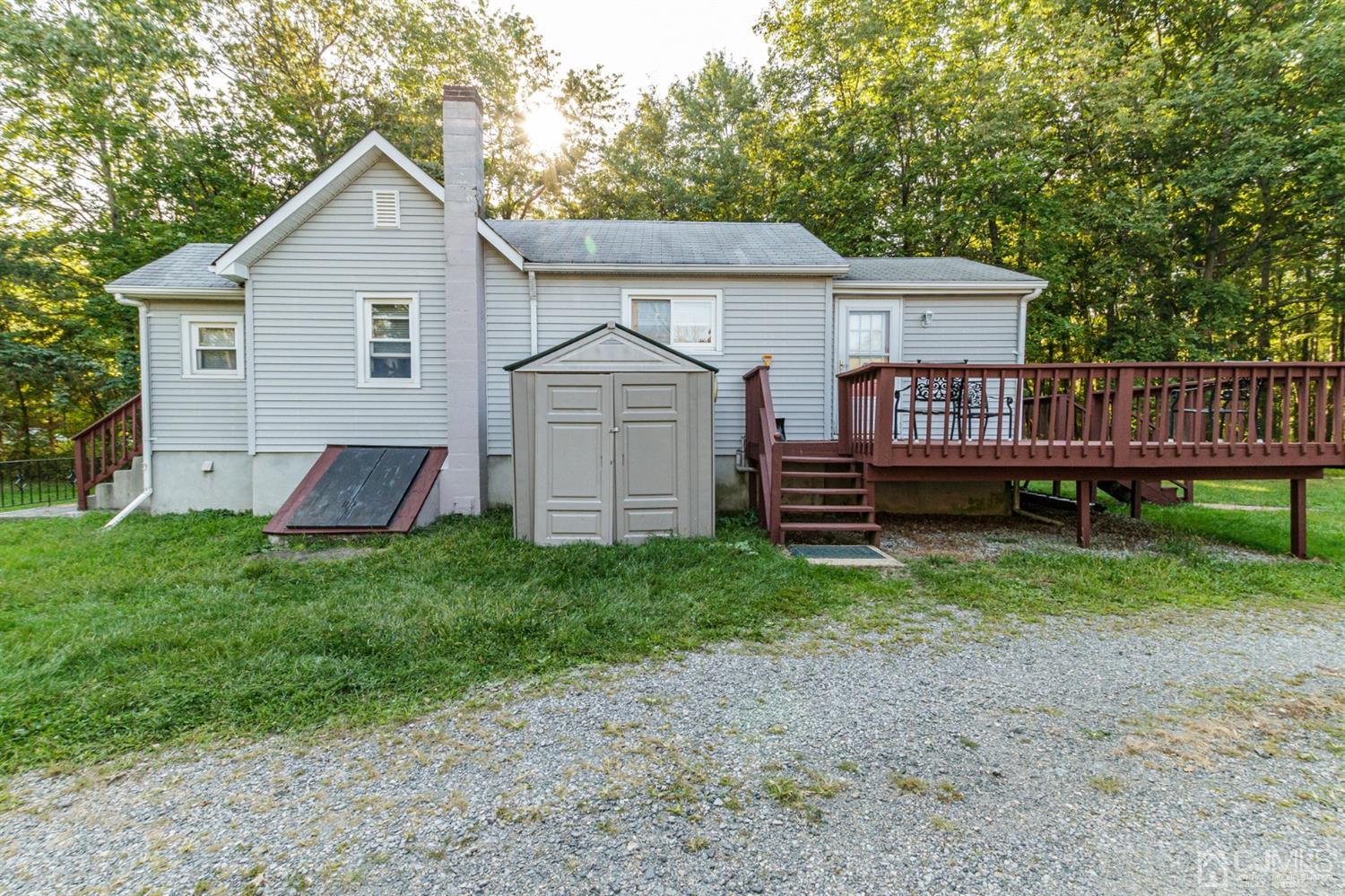 104 Oak Grove Road Flemington, NJ 08822 - Photo 9 of 25 a view of a house with a yard and deck