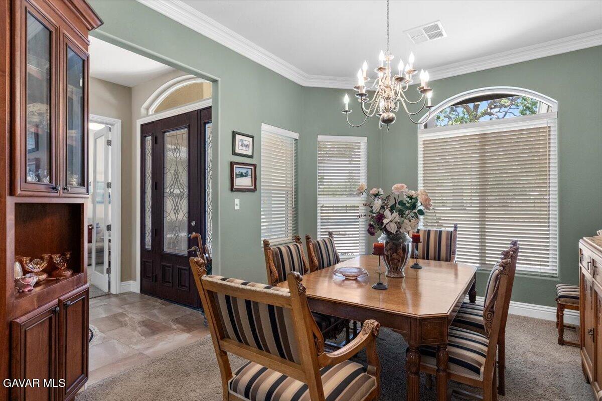 23840 Martingale Way Tehachapi, CA 93561 - Photo 9 of 63 a view of a dining room with furniture a chandelier and window