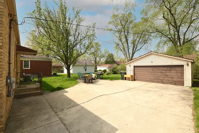 a yellow house with trees in front of it