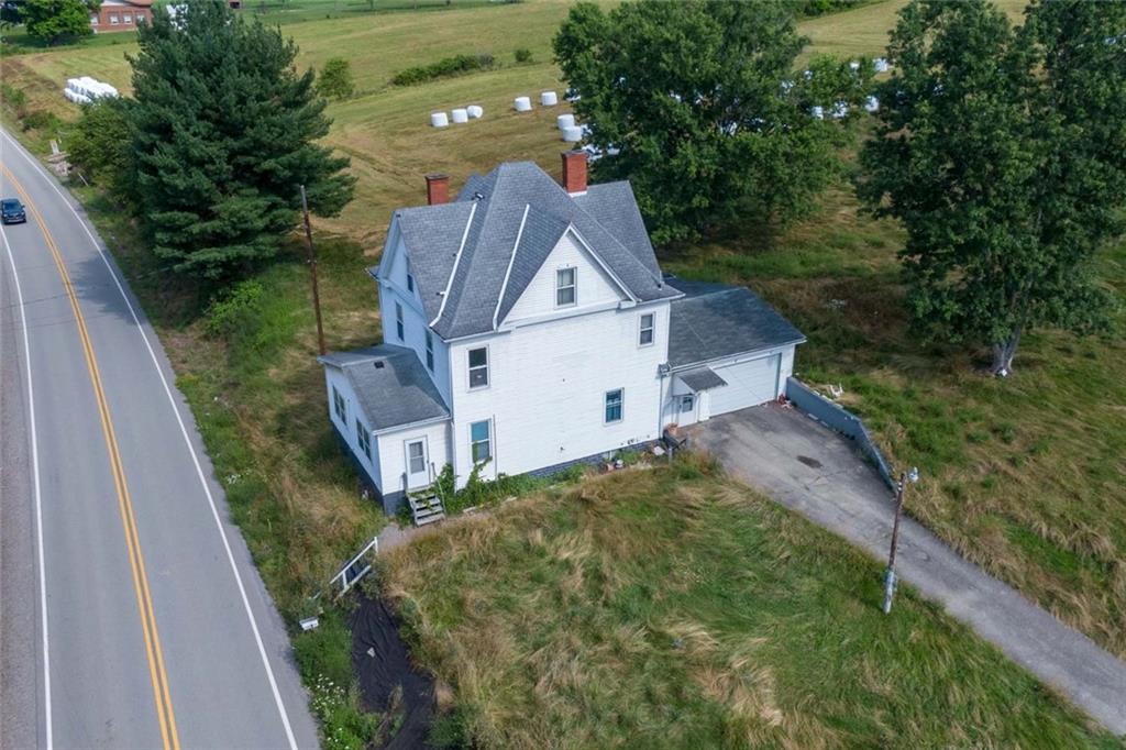 823 Lippencott Road Waynesburg, PA 15370 - Photo 2 of 25 a house view with a garden space