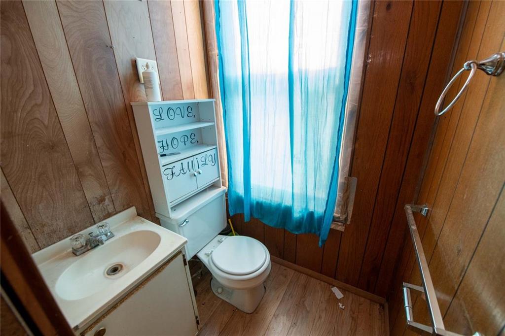 823 Lippencott Road Waynesburg, PA 15370 - Photo 11 of 25 a bathroom with a toilet a sink and a shower